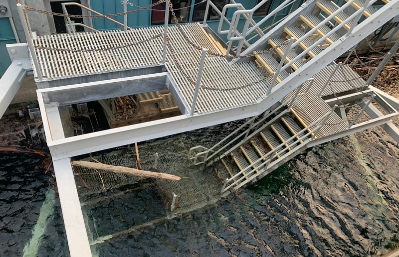 Metal stairs going under water.