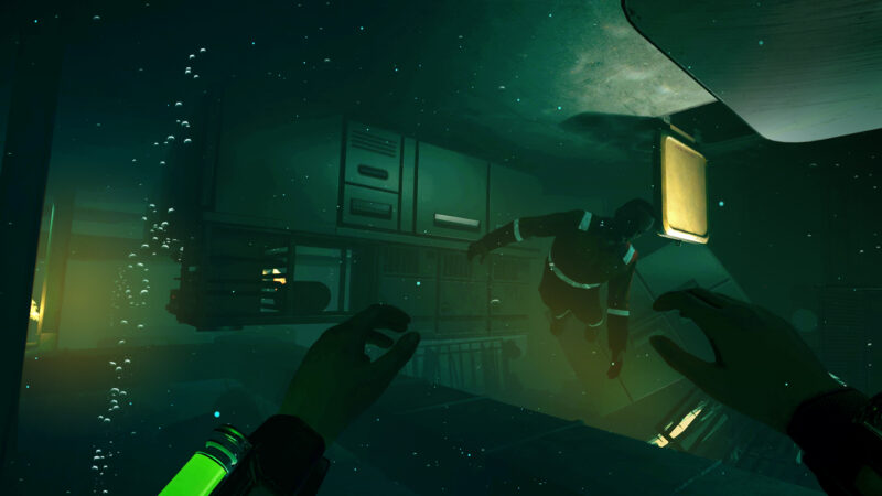 Freediver: divers in an upturned ship underwater.